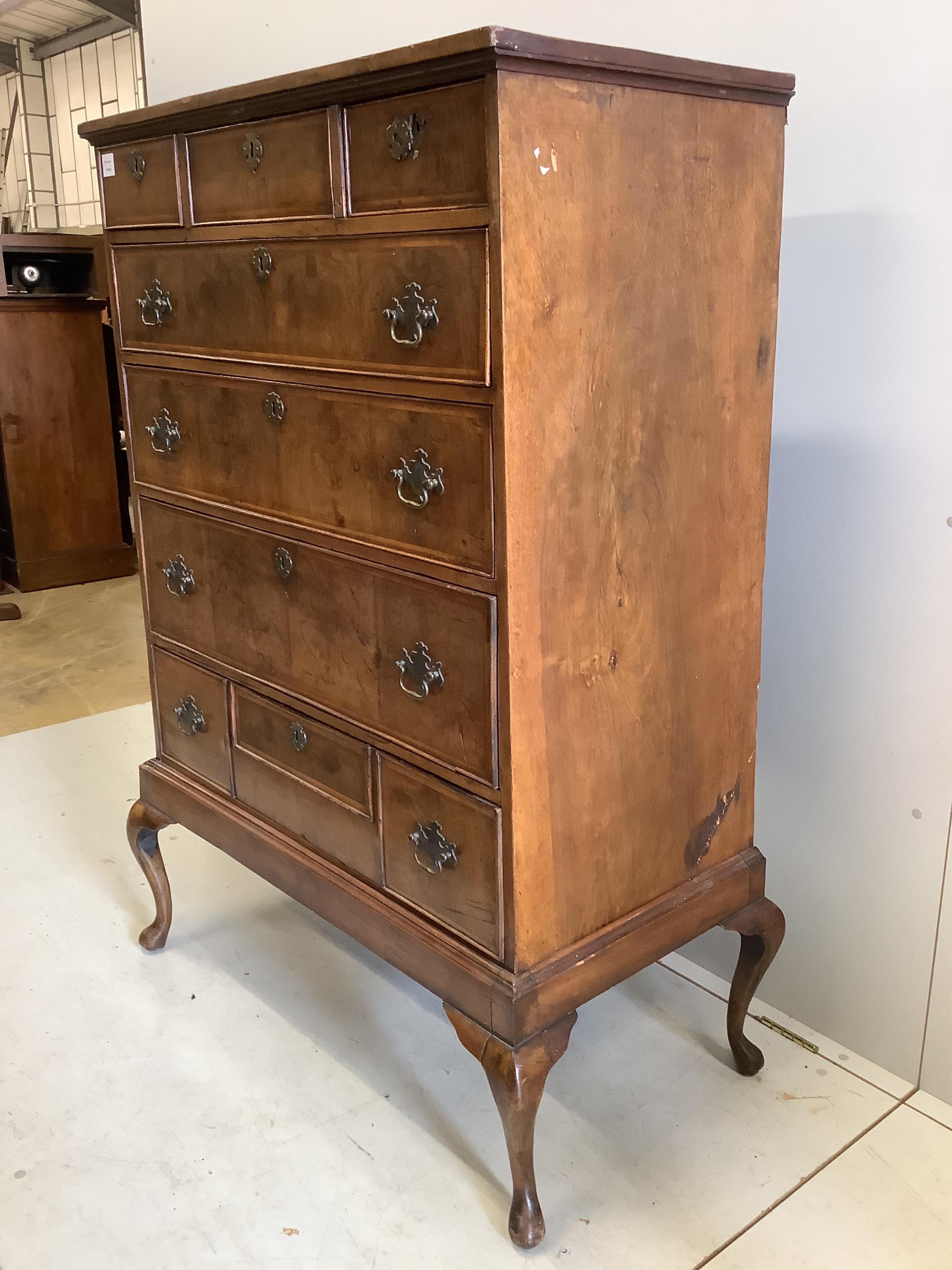 An 18th century and later feather-banded walnut chest on stand, width 96cm, depth 51cm, height 144cm